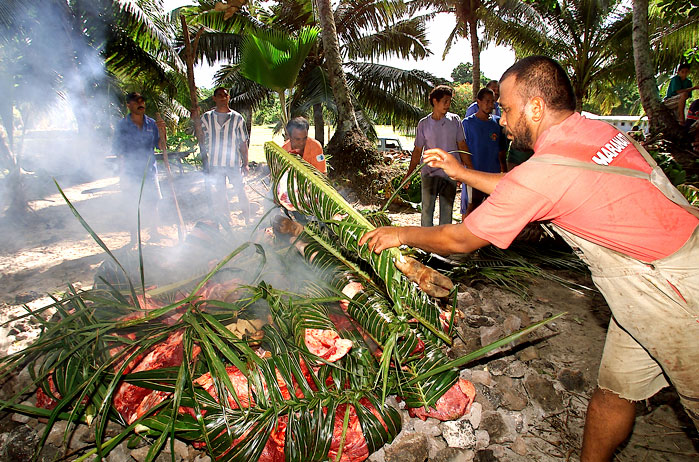 Tuna and meat has been cooked in traditional Fijian Lovo cooking methods